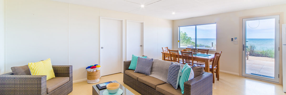 Mackerel-Islands-accommodation-beachfront-cabin-lounge-dining-2-slider