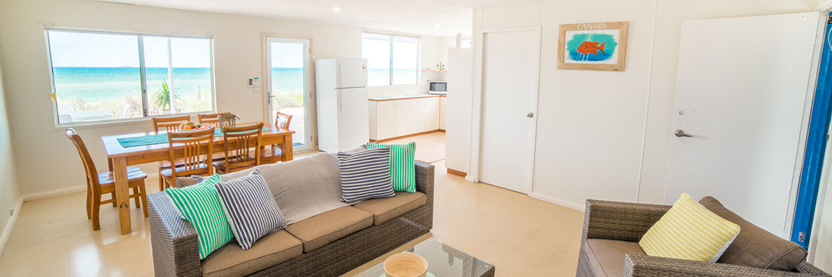 Mackerel-Islands-accommodation-beachfront-cabin-lounge-dining-3-slider